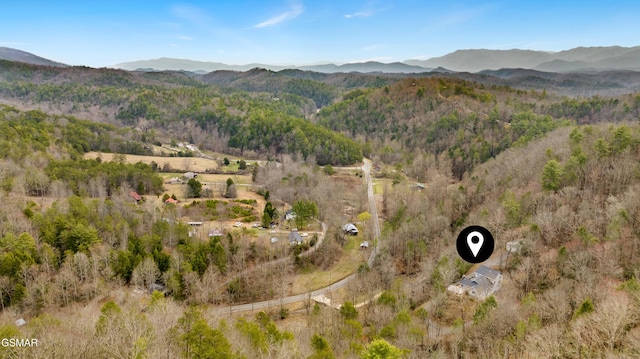 bird's eye view with a forest view and a mountain view