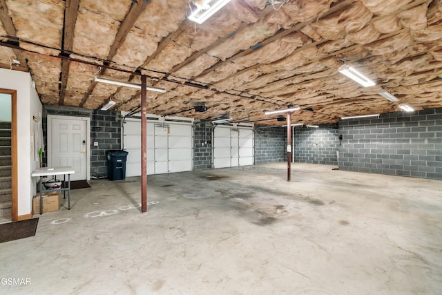 garage featuring concrete block wall