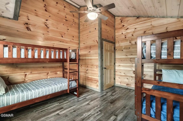 bedroom with lofted ceiling, wooden walls, wood finished floors, and wood ceiling