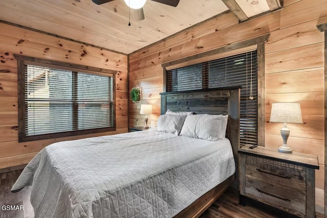 bedroom featuring wooden walls and wood finished floors