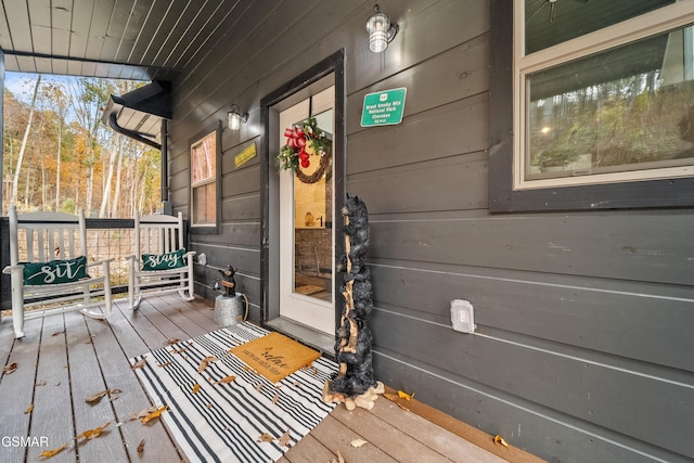 wooden terrace featuring a porch