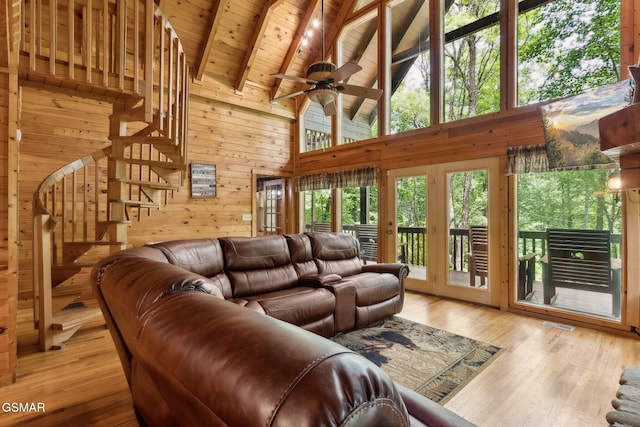 2112 Redmond Way, Sevierville, TN 37876 - living area with wood walls, wooden ceiling with exposed beams, ceiling fan, high vaulted ceiling, and hardwood / wood-style flooring