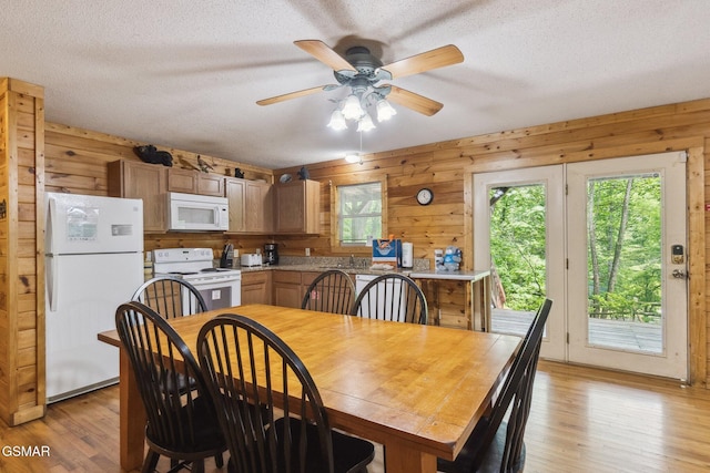 2112 Redmond Way, Sevierville, TN 37876 - dining area with wood walls, a textured ceiling, light wood finished floors, and ceiling fan