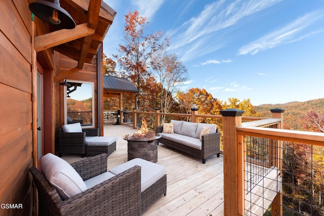 2741 Red Sky Dr, Sevierville, TN 37862 - wooden deck featuring an outdoor living space with a fire pit