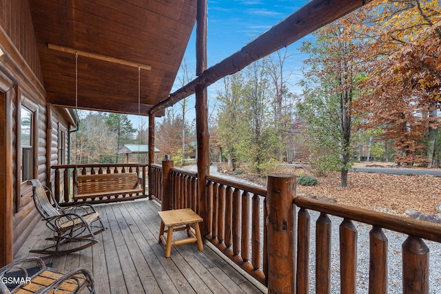 wooden terrace featuring a porch