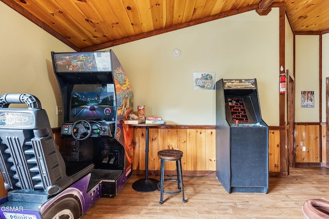 bar featuring lofted ceiling, wooden ceiling, wood walls, and hardwood / wood-style floors