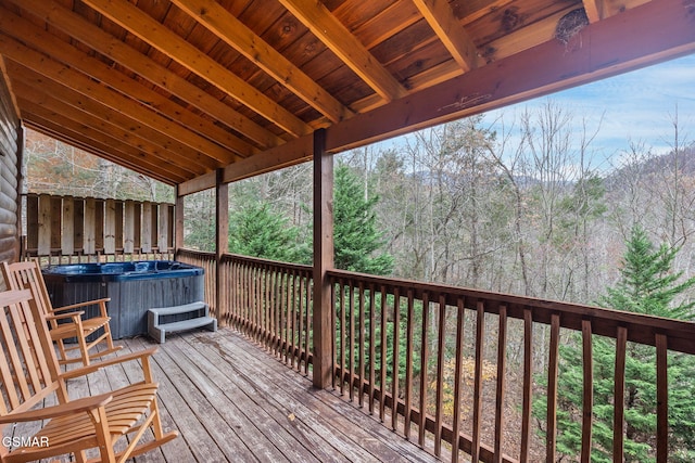 wooden terrace with a hot tub