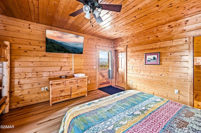 2251 Upper Middle Creek Rd Unit 8, Sevierville, TN 37876 - bedroom with access to outside, wooden ceiling, wooden walls, wood-type flooring, and a ceiling fan