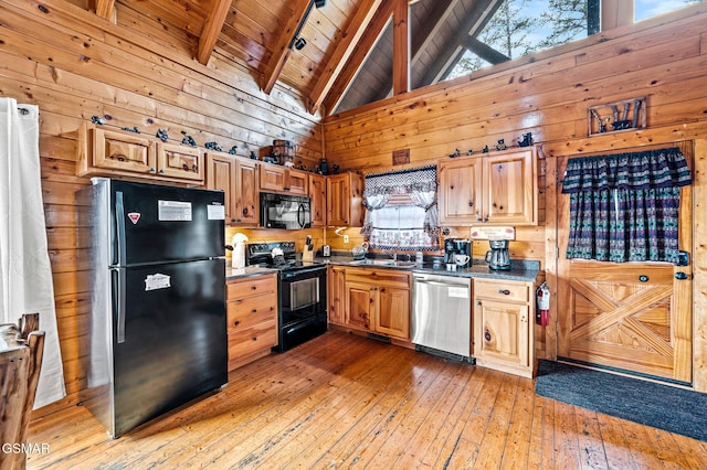 2251 Upper Middle Creek Rd Unit 8, Sevierville, TN 37876 - kitchen featuring black appliances, wood walls, a wooden ceiling with exposed beams, light wood finished floors, and high vaulted ceiling