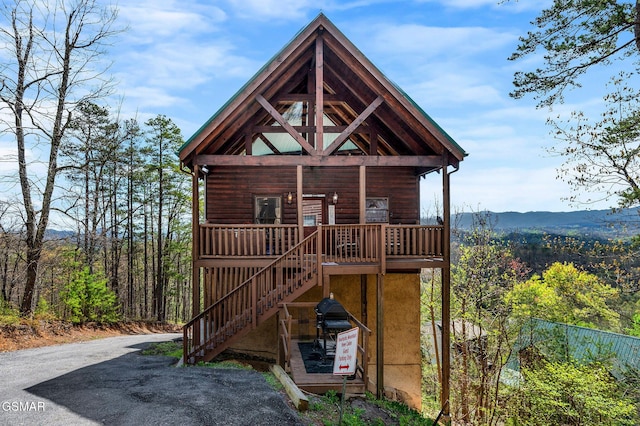 2251 Upper Middle Creek Rd Unit 8, Sevierville, TN 37876 - view of front of property featuring stairs, a mountain view, and a wooded view