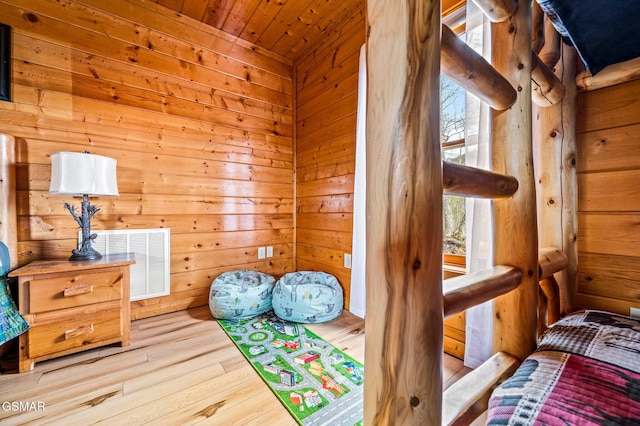 2251 Upper Middle Creek Rd Unit 8, Sevierville, TN 37876 - bedroom featuring wood finished floors and wooden walls