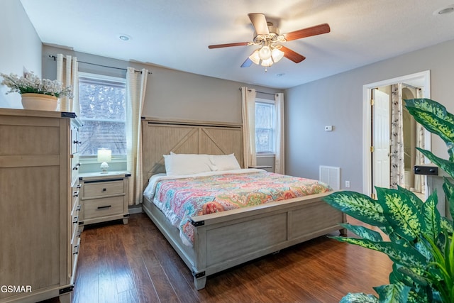 bedroom with dark wood-type flooring and ceiling fan