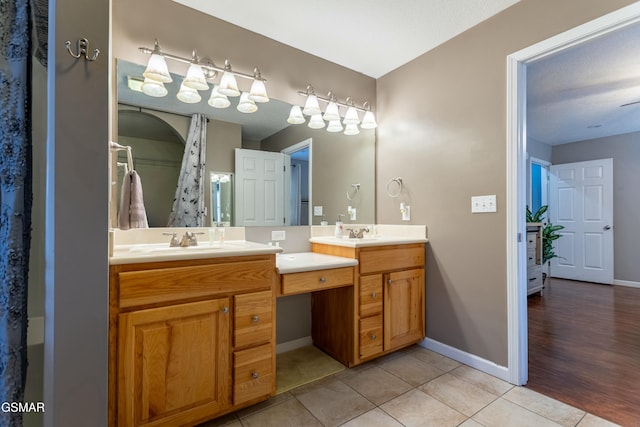 bathroom with vanity and tile patterned flooring