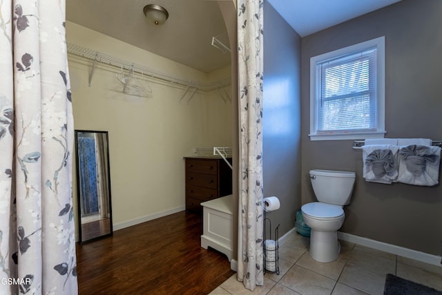 bathroom featuring vanity, hardwood / wood-style floors, and toilet