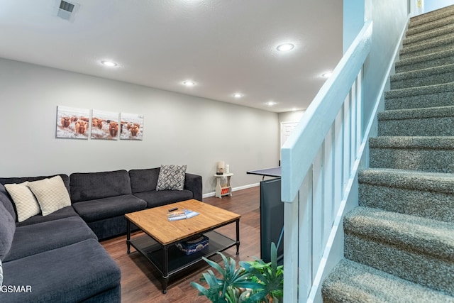 living room with dark hardwood / wood-style flooring