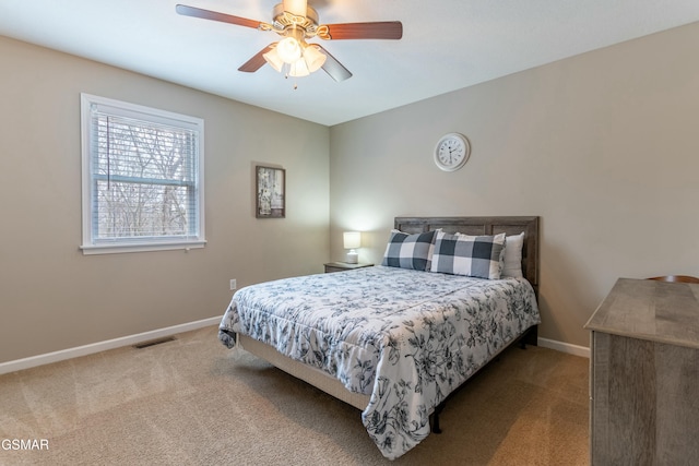 bedroom with light carpet and ceiling fan