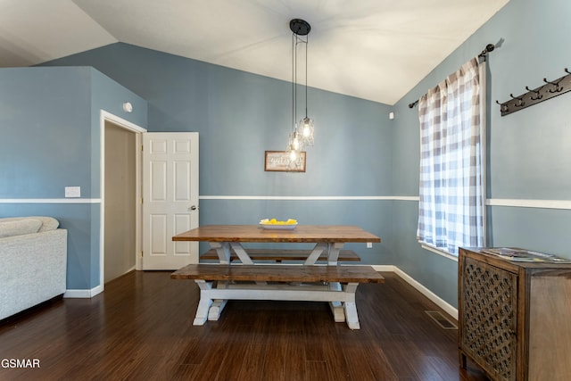 dining room with lofted ceiling, dark wood-type flooring, and breakfast area