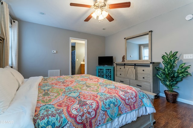 bedroom with ceiling fan and dark hardwood / wood-style floors