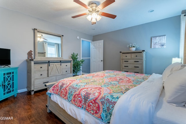 bedroom featuring dark wood-type flooring and ceiling fan