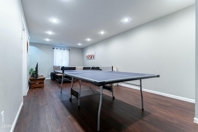 game room with dark hardwood / wood-style floors