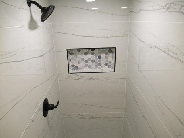 room details with a tile shower