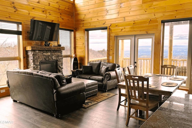 1854 Billard Way, Sevierville, TN 37876 - living room with wooden walls, wood finished floors, a stone fireplace, and french doors