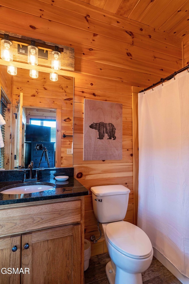 1854 Billard Way, Sevierville, TN 37876 - bathroom featuring vanity, wood walls, curtained shower, and wood ceiling