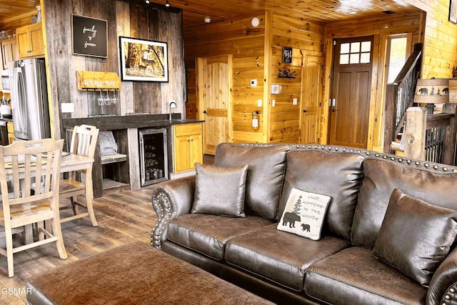 1854 Billard Way, Sevierville, TN 37876 - living area featuring wine cooler, wood walls, wood ceiling, and wood finished floors