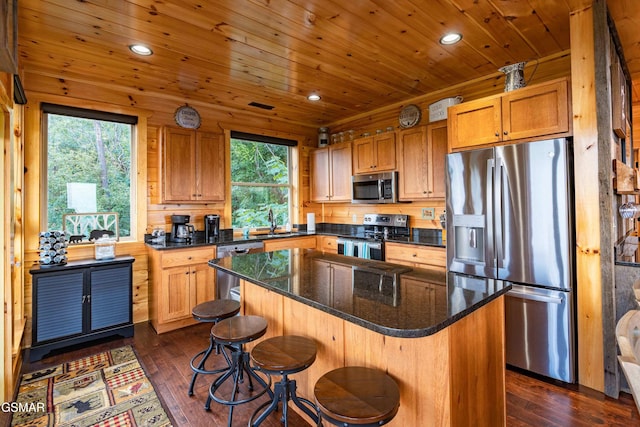 1854 Billard Way, Sevierville, TN 37876 - kitchen with stainless steel appliances, recessed lighting, dark wood-style flooring, a kitchen island, and a breakfast bar area