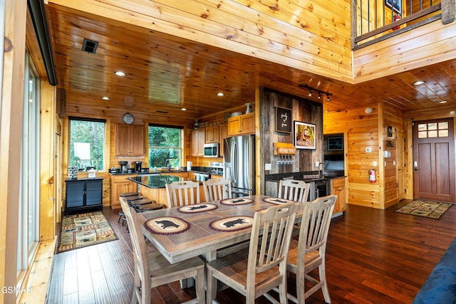 1854 Billard Way, Sevierville, TN 37876 - dining space featuring dark wood finished floors, wood walls, wood ceiling, and recessed lighting