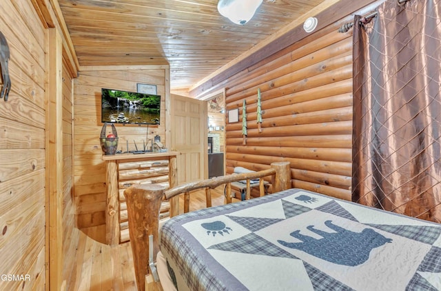 bedroom with wood-type flooring, rustic walls, and wooden ceiling