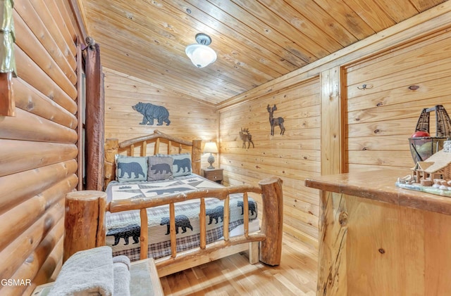 bedroom with wooden ceiling, vaulted ceiling, and wood finished floors
