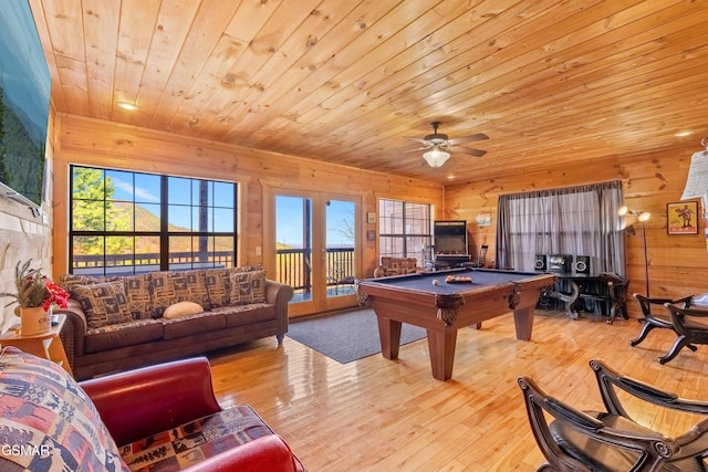 recreation room featuring billiards, hardwood / wood-style flooring, and a healthy amount of sunlight