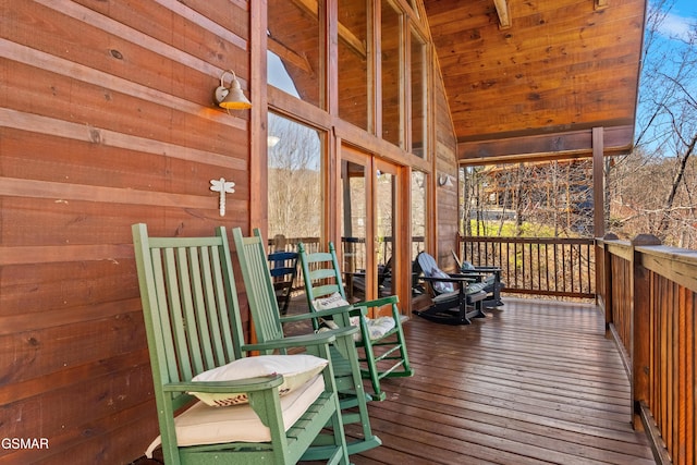 wooden terrace with a porch