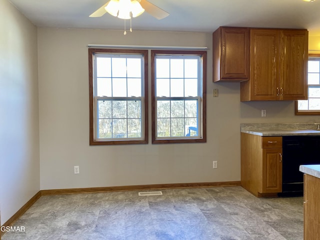 188 Riviera Dr, Newport, TN 37821 - kitchen with light countertops, a ceiling fan, black dishwasher, visible vents, and brown cabinetry