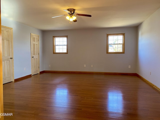 188 Riviera Dr, Newport, TN 37821 - empty room with a wealth of natural light, ceiling fan, and wood finished floors
