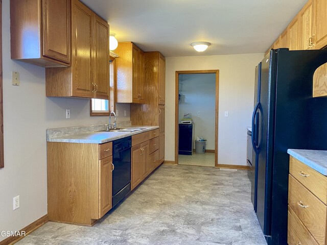 188 Riviera Dr, Newport, TN 37821 - kitchen featuring baseboards, light countertops, a sink, and black appliances
