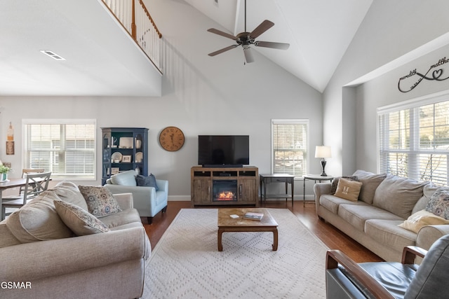 living room featuring a wealth of natural light and wood-type flooring