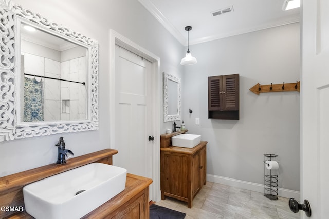 bathroom with crown molding, curtained shower, and vanity