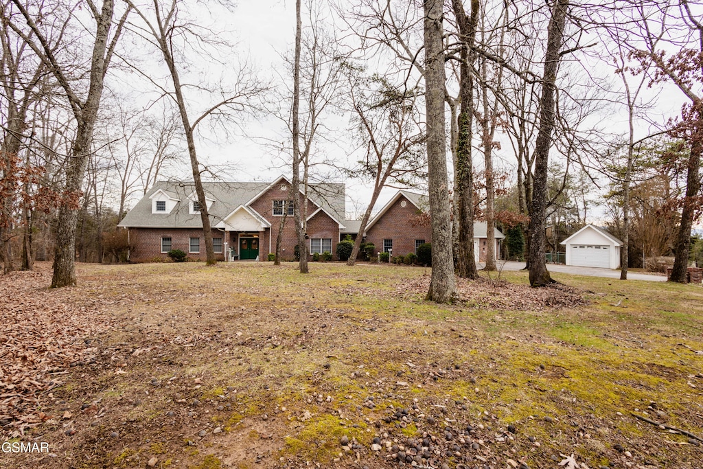 view of front of property with an outbuilding and a garage