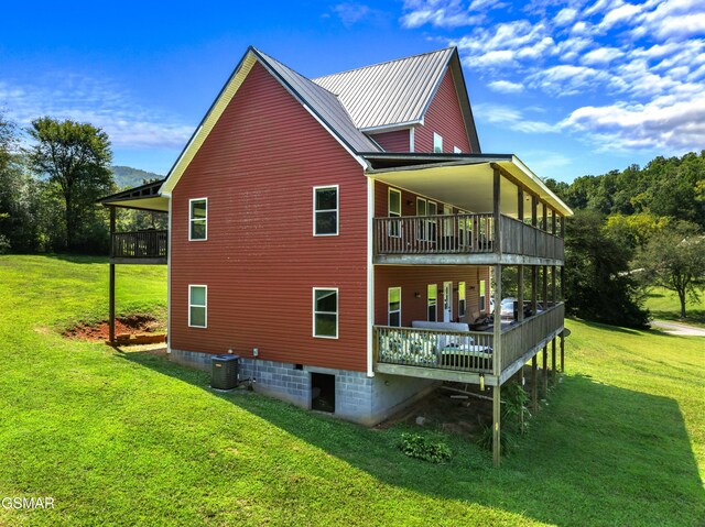 2560 Schisandra Ln, Cosby, TN 37722 - view of side of home with a lawn, crawl space, a balcony, and a wooden deck