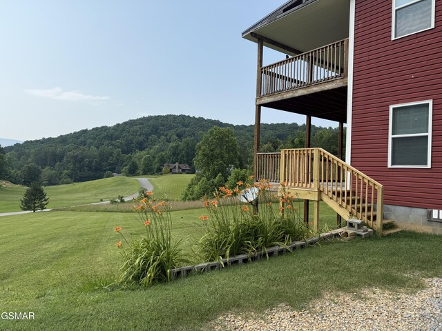 2560 Schisandra Ln, Cosby, TN 37722 - view of grassy yard featuring a view of trees and a balcony