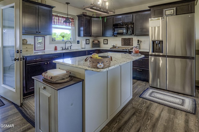 2045 Kings View Loop, Seymour, TN 37865 - kitchen with dark wood-style floors, a sink, light stone counters, a kitchen island, and appliances with stainless steel finishes