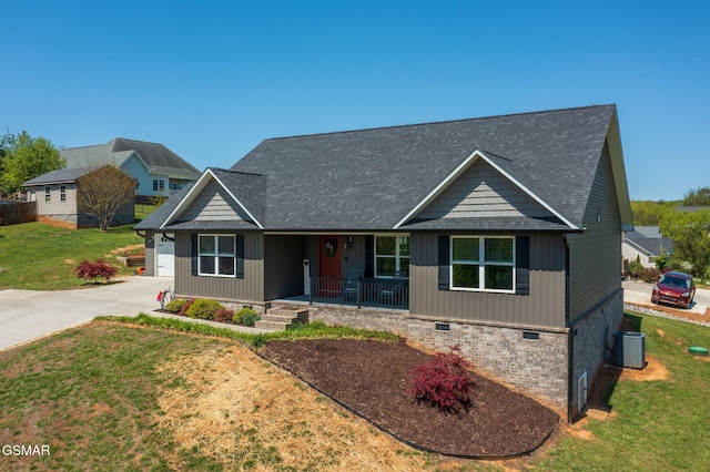 2045 Kings View Loop, Seymour, TN 37865 - view of front of house featuring central AC unit, a shingled roof, concrete driveway, a porch, and a front yard