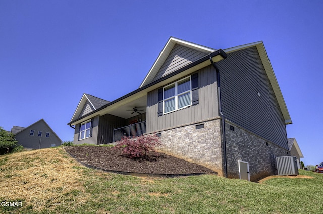 2045 Kings View Loop, Seymour, TN 37865 - view of side of property featuring board and batten siding, a ceiling fan, and a lawn