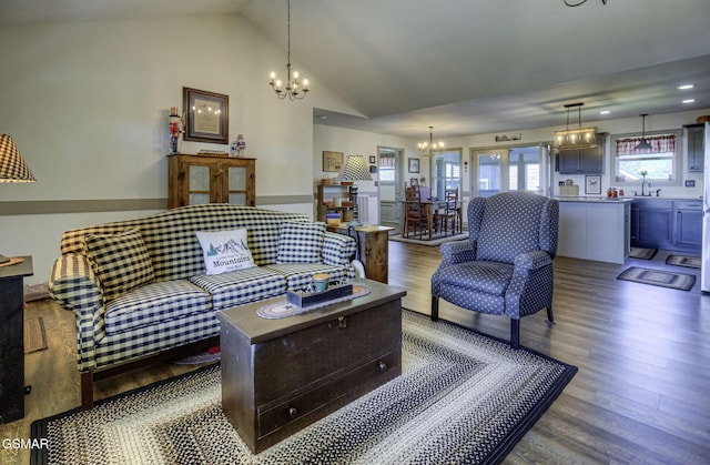2045 Kings View Loop, Seymour, TN 37865 - living area with lofted ceiling, wood finished floors, and an inviting chandelier