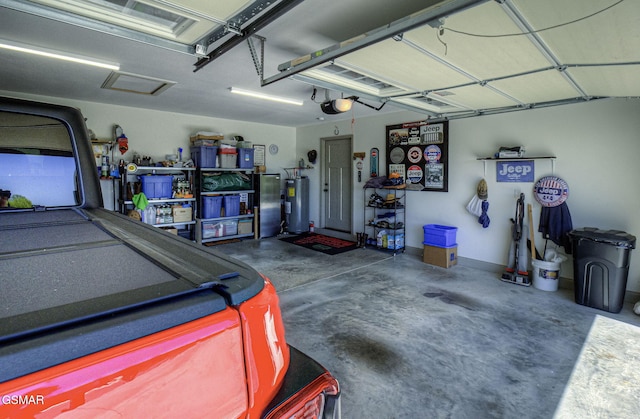 2045 Kings View Loop, Seymour, TN 37865 - garage with electric water heater and a garage door opener