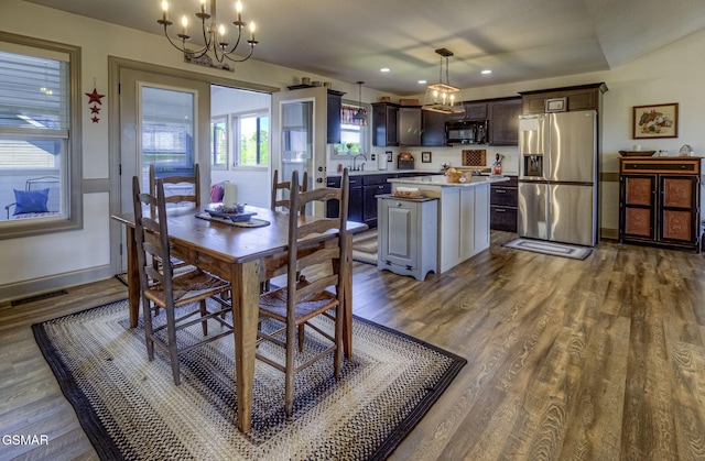 2045 Kings View Loop, Seymour, TN 37865 - dining space with dark wood-style floors, an inviting chandelier, visible vents, and baseboards