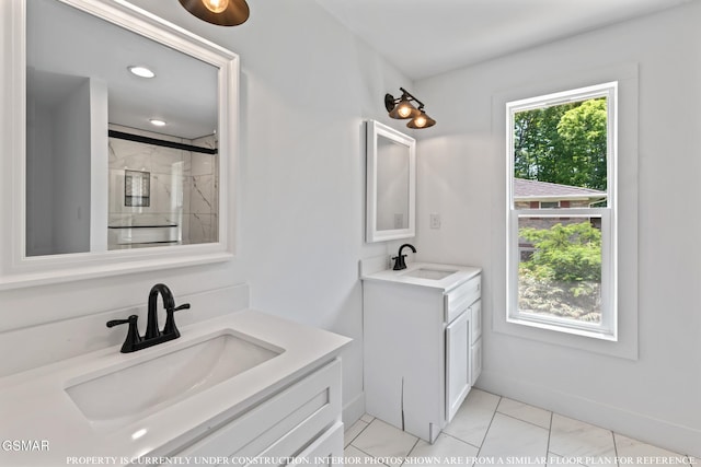 bathroom with a shower with door and vanity