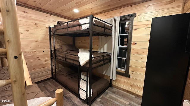 1504 Ginnys Trl, Sevierville, TN 37876 - unfurnished bedroom featuring wood walls, wooden ceiling, and wood finished floors